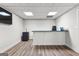 The finished basement has a functional wet bar, durable floors, neutral walls, and modern appliances at 105 Riviera Ct, Fayetteville, GA 30215