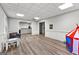 Finished basement offers a versatile area with durable floors, a play area, and neutral colors at 105 Riviera Ct, Fayetteville, GA 30215