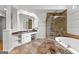 Bright bathroom showcasing a glass shower and a double vanity with granite countertop at 105 Riviera Ct, Fayetteville, GA 30215