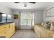 Inviting bedroom with neutral tones featuring a bed, yellow dresser, and large windows at 105 Riviera Ct, Fayetteville, GA 30215