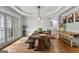 Beautiful dining room featuring a custom table, tray ceiling, and large windows at 105 Riviera Ct, Fayetteville, GA 30215