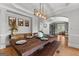 Formal dining room with custom table and stylish light fixture at 105 Riviera Ct, Fayetteville, GA 30215
