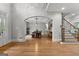 Elegant dining room featuring an archway, hardwood floors, and natural light at 105 Riviera Ct, Fayetteville, GA 30215