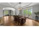 Elegant dining room with large windows, custom table and plenty of natural light at 105 Riviera Ct, Fayetteville, GA 30215