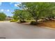 A charming neighborhood street view with lush green lawns and meticulously trimmed shrubs, enhancing curb appeal at 105 Riviera Ct, Fayetteville, GA 30215