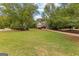 A sprawling front lawn leads up to a well-maintained home, showcasing the property's spaciousness and curb appeal at 105 Riviera Ct, Fayetteville, GA 30215