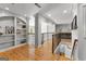Second-floor hallway featuring custom built-in shelving and wood floors at 105 Riviera Ct, Fayetteville, GA 30215