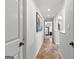 Hallway features unique flooring, recessed lighting, and access to multiple rooms at 105 Riviera Ct, Fayetteville, GA 30215