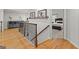 Light-filled hallway with hardwood floors and access to multiple bedrooms at 105 Riviera Ct, Fayetteville, GA 30215
