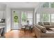 Sitting area with hardwood floors, fireplace, lots of windows and natural light at 105 Riviera Ct, Fayetteville, GA 30215