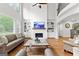 Stunning living room with a fireplace, custom built-ins, and soaring ceilings with natural light at 105 Riviera Ct, Fayetteville, GA 30215