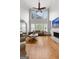 Bright living room with tall ceilings, a fireplace, large windows, and comfortable seating at 105 Riviera Ct, Fayetteville, GA 30215