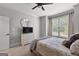 Primary bedroom featuring a ceiling fan, neutral carpet, and window at 105 Riviera Ct, Fayetteville, GA 30215