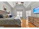Bright main bedroom features tray ceiling, an ensuite bathroom, and large windows at 105 Riviera Ct, Fayetteville, GA 30215