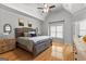 Main bedroom boasts a vaulted ceiling, a ceiling fan, and an ensuite bathroom at 105 Riviera Ct, Fayetteville, GA 30215