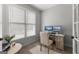 Well-lit home office with large windows, desk, and comfortable seating for remote work at 105 Riviera Ct, Fayetteville, GA 30215