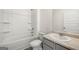 Bright bathroom features a shower-tub combo, white fixtures, and neutral-toned walls at 572 Whitman Ln # 19, Stockbridge, GA 30281