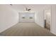 Expansive bedroom with plush carpet, ceiling fan, and abundant natural light from large windows at 572 Whitman Ln # 19, Stockbridge, GA 30281