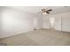 Well-lit bedroom showcasing neutral carpet, ample space, and multiple doorways for easy access at 572 Whitman Ln # 19, Stockbridge, GA 30281