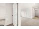 Bright bedroom featuring neutral carpet and a five panel door at 572 Whitman Ln # 19, Stockbridge, GA 30281