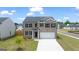 Charming two-story brick home with a well-manicured lawn and a two-car garage at 572 Whitman Ln # 19, Stockbridge, GA 30281