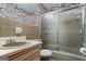 Bathroom featuring tiled walls, a single sink vanity, and a glass-enclosed shower at 725 & 761 School Road, Hampton, GA 30228
