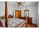Comfortable bedroom featuring hardwood floors, ceiling fan, and classic furnishings at 725 & 761 School Road, Hampton, GA 30228