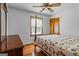 Cozy bedroom features hardwood floors, a ceiling fan, and ample natural light at 725 & 761 School Road, Hampton, GA 30228