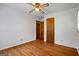Bright bedroom with hardwood floors, ceiling fan, and wood trim at 725 & 761 School Road, Hampton, GA 30228