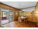 Traditional dining room showcasing wood paneling and a cozy table setting at 725 & 761 School Road, Hampton, GA 30228