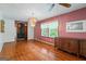 A dining room boasts hardwood floors, vintage decor, and wood-burning stove at 725 & 761 School Road, Hampton, GA 30228