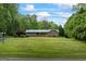 Charming single-story home with a well-manicured lawn and lush landscaping at 725 & 761 School Road, Hampton, GA 30228