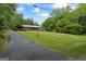 Charming brick home with a well-manicured lawn and mature trees at 725 & 761 School Road, Hampton, GA 30228