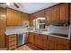 Functional kitchen with updated appliances, wood cabinets, and marble counter tops at 725 & 761 School Road, Hampton, GA 30228