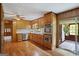 Well-lit kitchen with wooden cabinets and modern stainless steel appliances at 725 & 761 School Road, Hampton, GA 30228