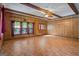 Spacious living room with laminate floors, wood beams, and natural light at 725 & 761 School Road, Hampton, GA 30228