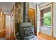 Interior view featuring a wood burning stove and hardwood flooring at 725 & 761 School Road, Hampton, GA 30228