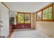 Sun-drenched sunroom with checkered tile flooring and ample natural light at 725 & 761 School Road, Hampton, GA 30228