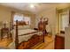Spacious bedroom with hardwood floors, ceiling fan, and vintage furniture at 1349 Springwood Nw Dr, Conyers, GA 30012