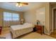 Cozy bedroom with hardwood floors and two side tables at 1349 Springwood Nw Dr, Conyers, GA 30012