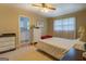 Comfortable bedroom with hardwood floors and ensuite bathroom at 1349 Springwood Nw Dr, Conyers, GA 30012