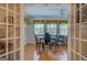 Dining room with wood floors is connected to the kitchen and living room at 1349 Springwood Nw Dr, Conyers, GA 30012