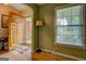 Foyer with hardwood floors, decorative door, and a window offering a bright, welcoming entrance at 1349 Springwood Nw Dr, Conyers, GA 30012