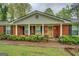 Close-up of the brick front porch, showing detailed pillars and classic front door with sidelights at 1349 Springwood Nw Dr, Conyers, GA 30012