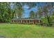Charming brick home featuring a well-manicured lawn and classic design, perfect for suburban living at 1349 Springwood Nw Dr, Conyers, GA 30012