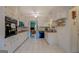 Spacious kitchen with white cabinetry, tile floors, and modern appliances at 1349 Springwood Nw Dr, Conyers, GA 30012