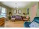 Bright living room boasts hardwood floors, chandelier, and natural light at 1349 Springwood Nw Dr, Conyers, GA 30012