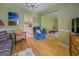 Open concept living room features hardwood floors, and a classic chandelier at 1349 Springwood Nw Dr, Conyers, GA 30012