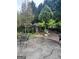 Inviting back patio with seating area and access to the garden at 374 Persimmon Dr, Sharpsburg, GA 30277