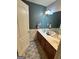 Bathroom with double sinks, vanity and decorative rug at 374 Persimmon Dr, Sharpsburg, GA 30277